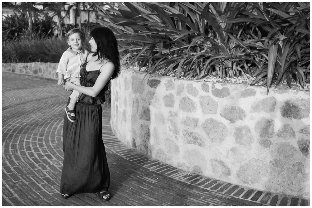 Mother holding her toddler during a Puerto Vallarta family photo session in black and white.