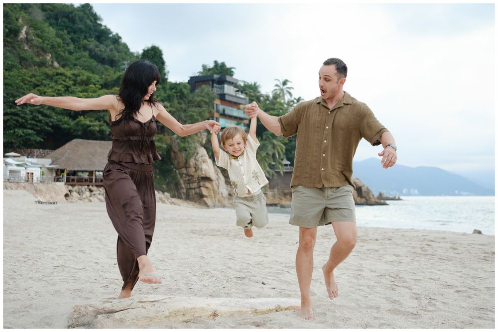 Family playing together during a Puerto Vallarta beach family photo session.