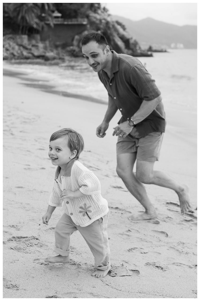 Black and white father and child portrait during a Puerto Vallarta beach family photo session.