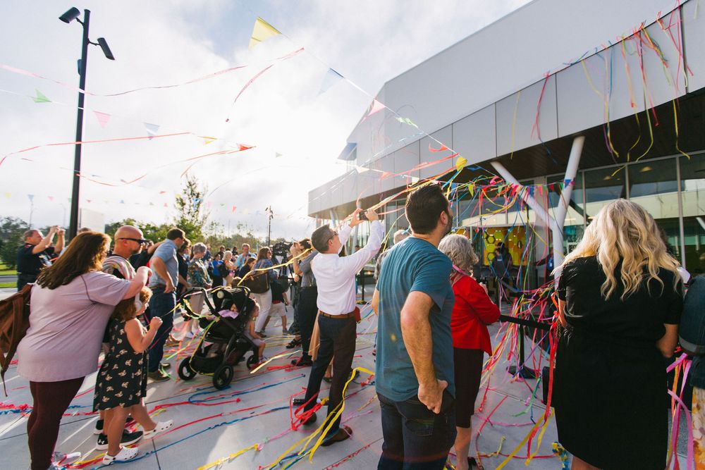 Corporate event photography in Lakeland, Florida. Large group celebrating Grand Opening of the Florida Children's Museum at Bonnet Springs.