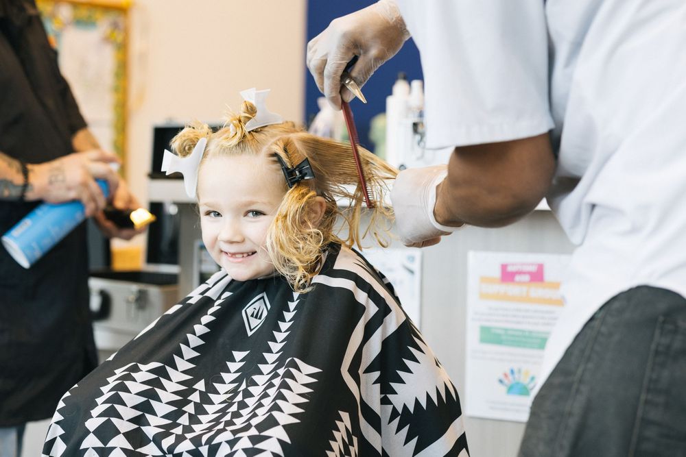 Photography of Florida Children's Museum's Day of Caring - Corporate Event - Community Celebration in Lakeland. Free childrens' haircuts.