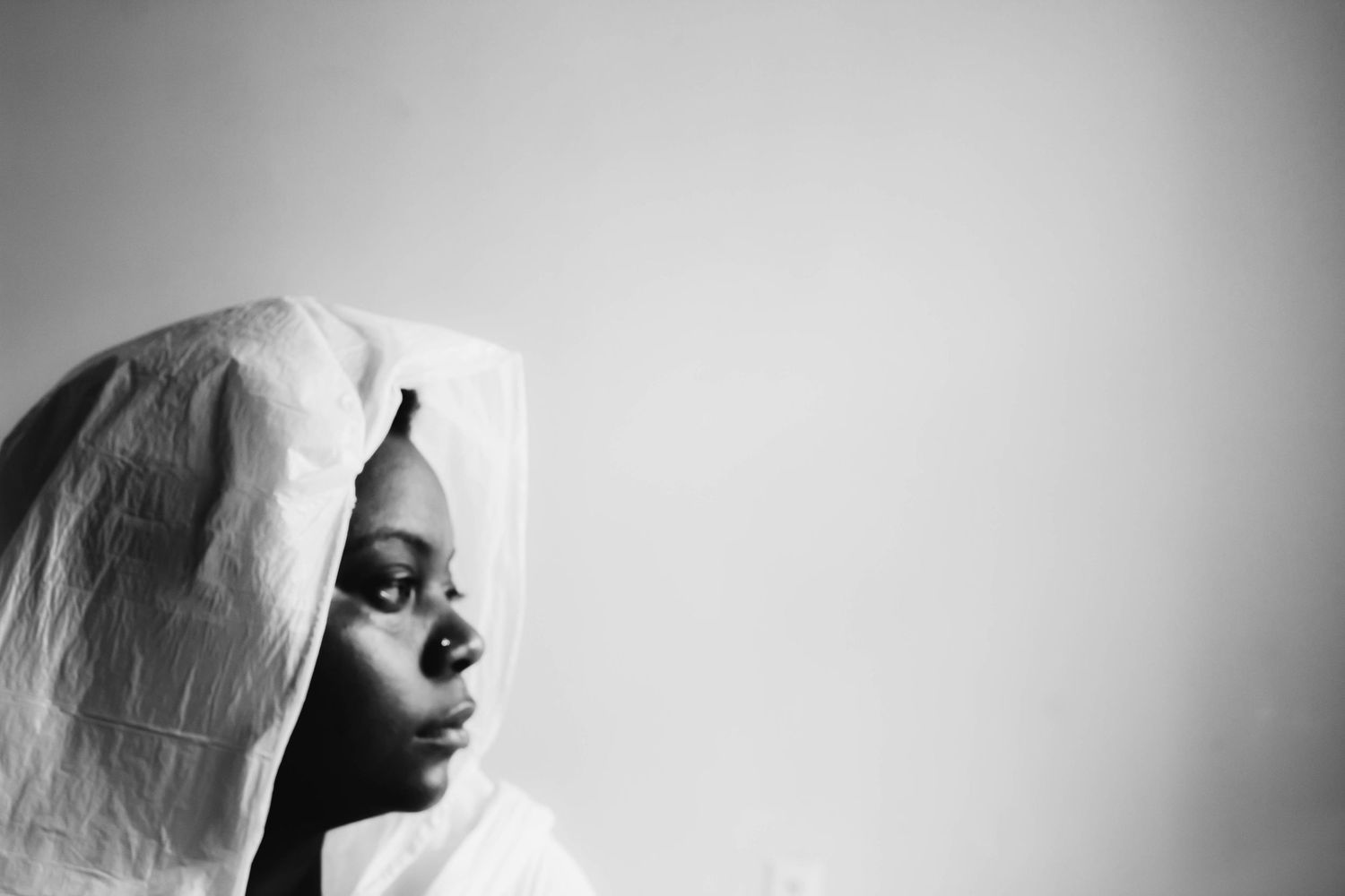 Black and white artistic photo series showing intimate moments of pregnancy and maternity in dramatic lighting.