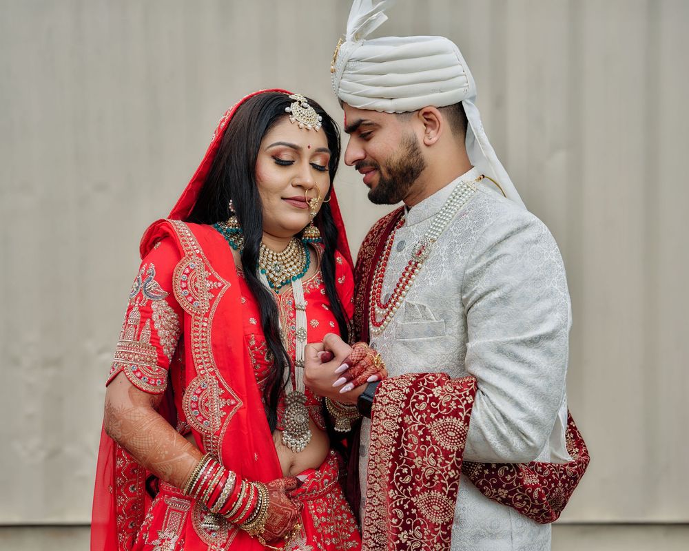 Couple in traditional South Asian wedding attire share intimate moments in a series of romantic portrait photos.