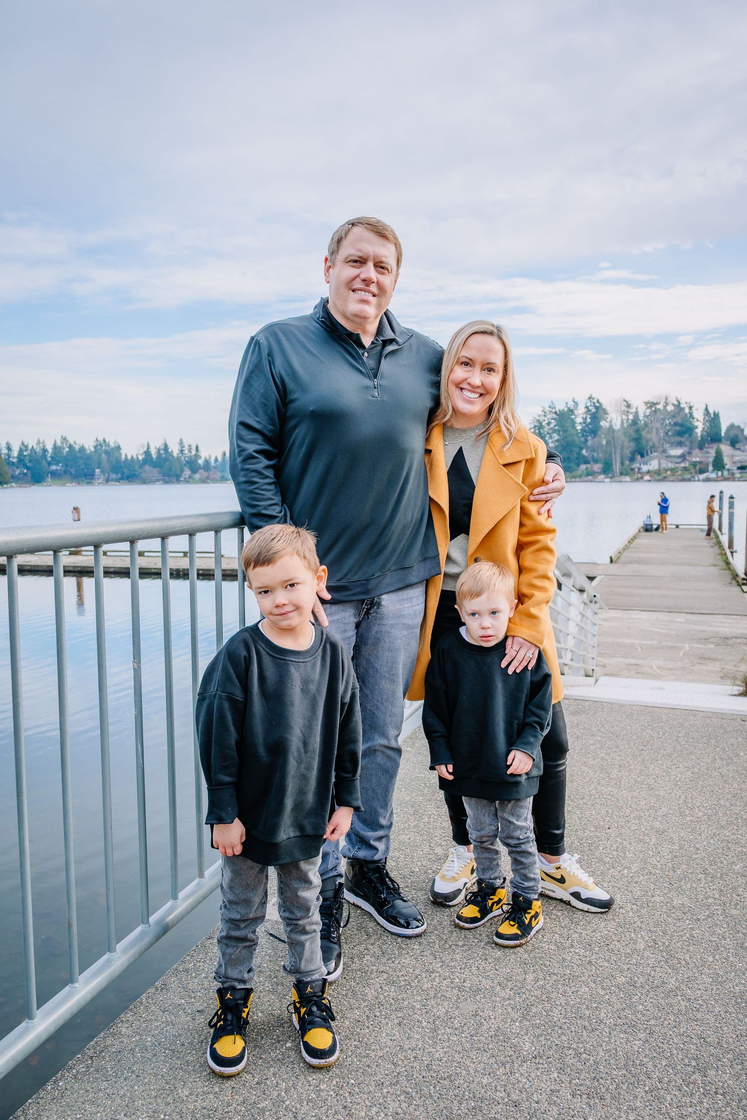 Family walking together during a relaxed outdoor photo session at Angel Lake Park