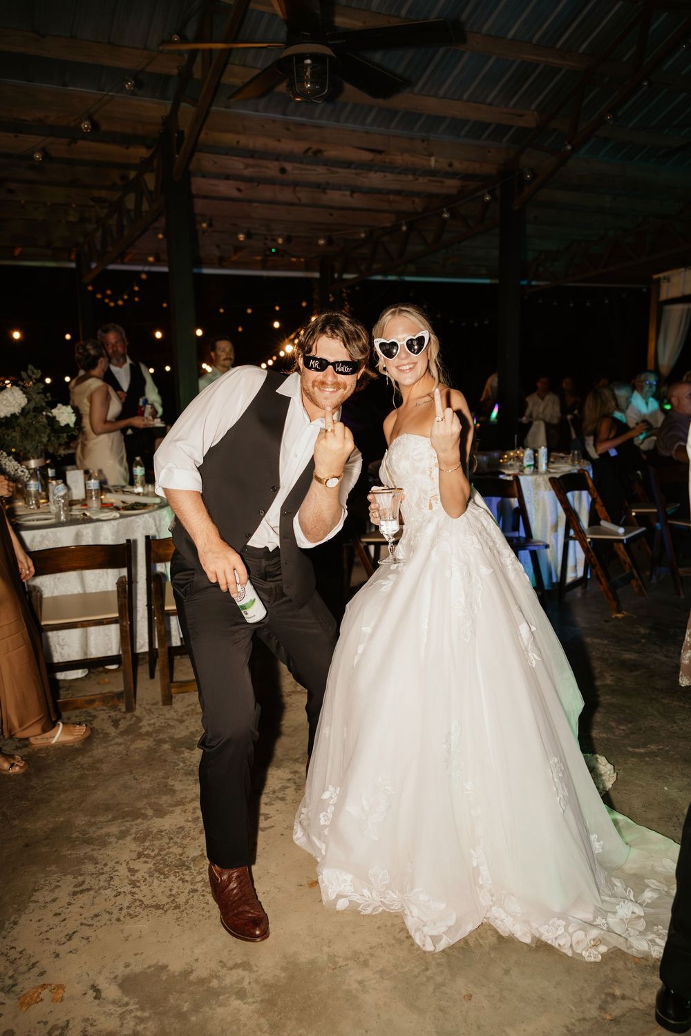 Wedding celebration in a historic mansion venue with party guests wearing sunglasses at The Elms of Coosada in Coosada, Alabama