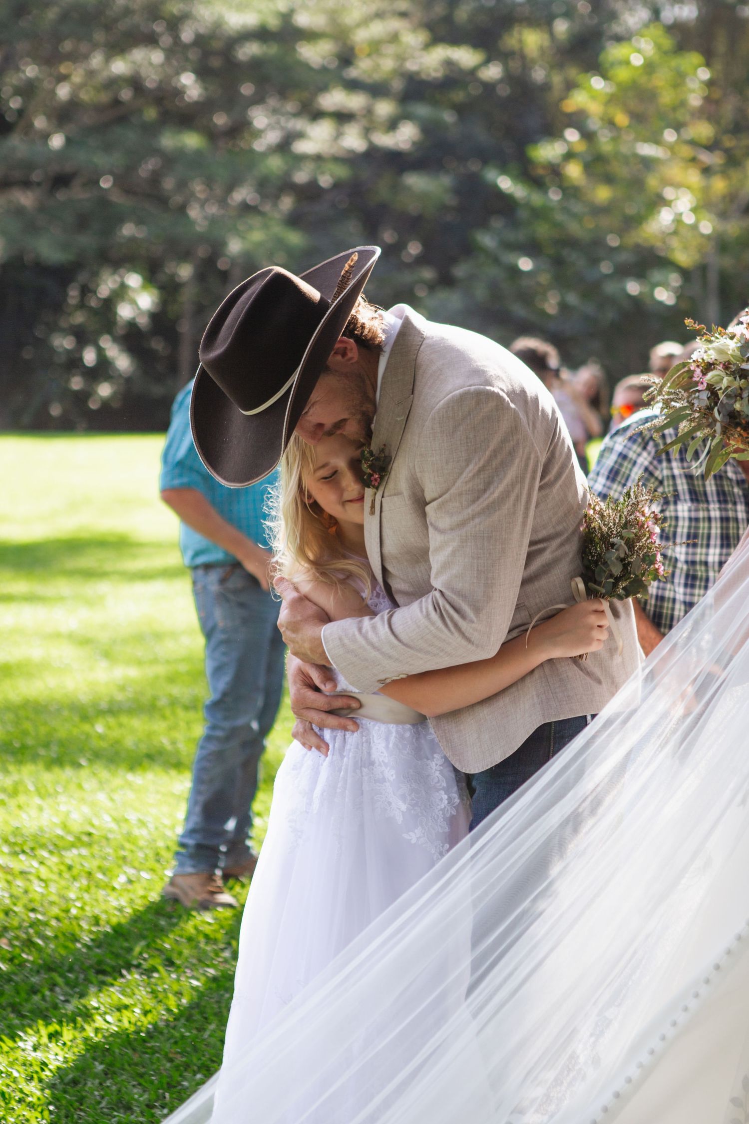 Groom hugging his new neice at country Port Douglas Wedding