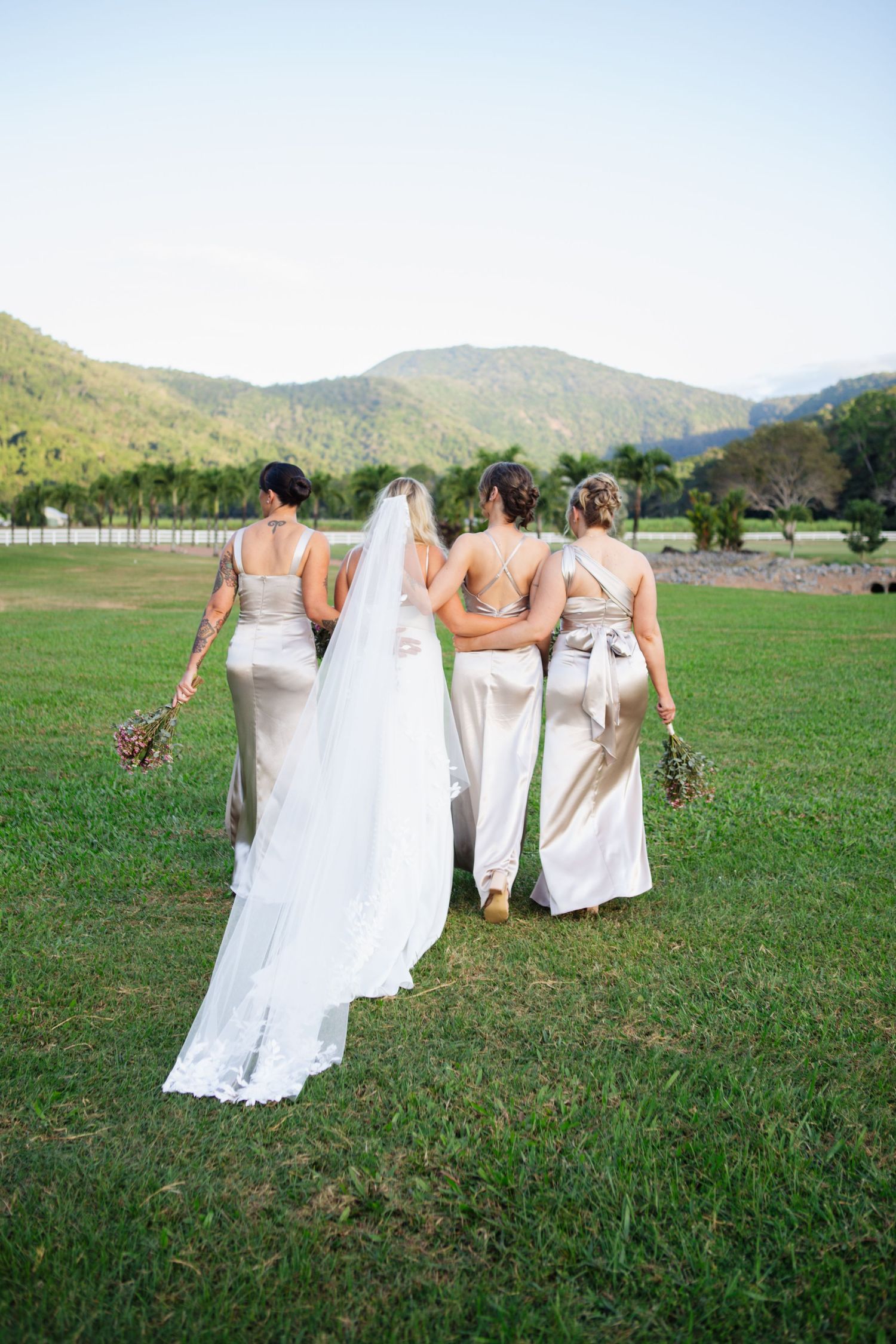 Bridesmaids walking away at country Port Douglas Wedding
