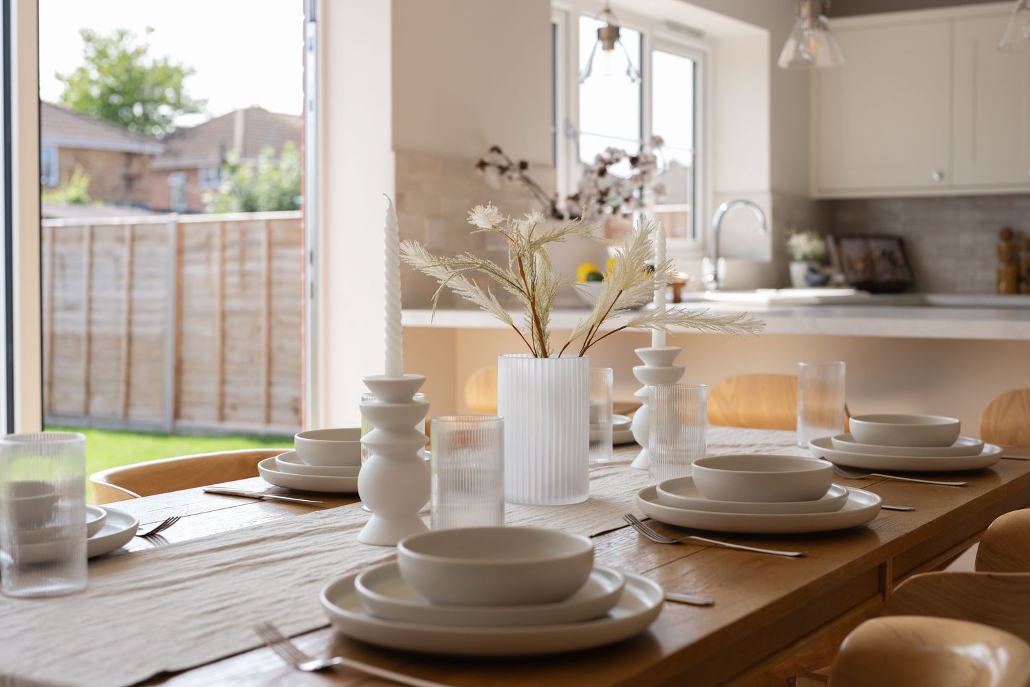 Property and interiors photography of a modern kitchen and dining space styled for entertaining