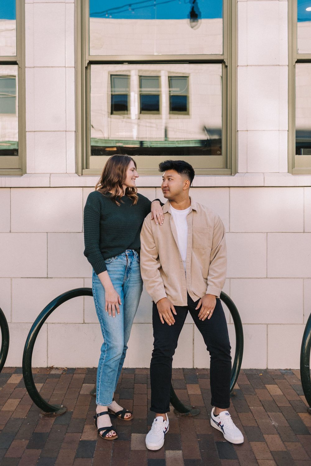 A couple sits together on a bench sharing intimate moments in a triptych style photo series.