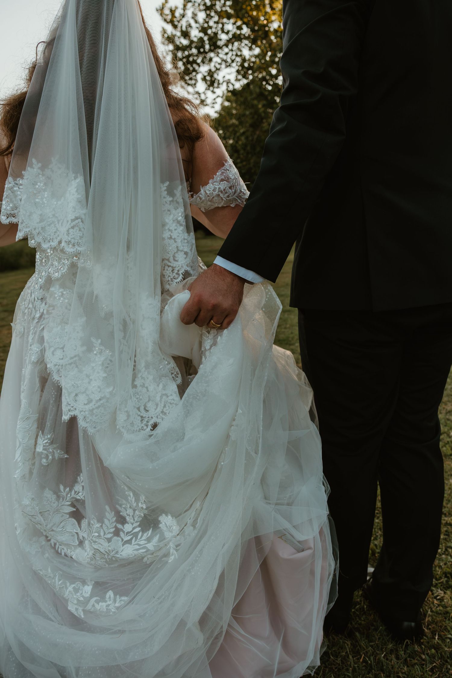 Intimate close-up of a couple in white sweaters sharing a tender moment.