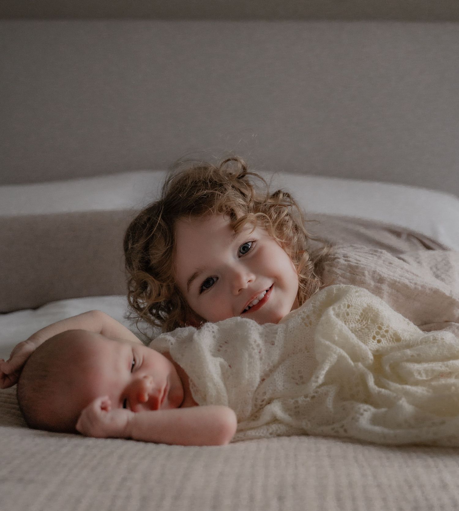 Soft light, gentle touches, and a sleepy newborn wrapped in love. Honest and emotive storytelling from a Leicestershire home session.