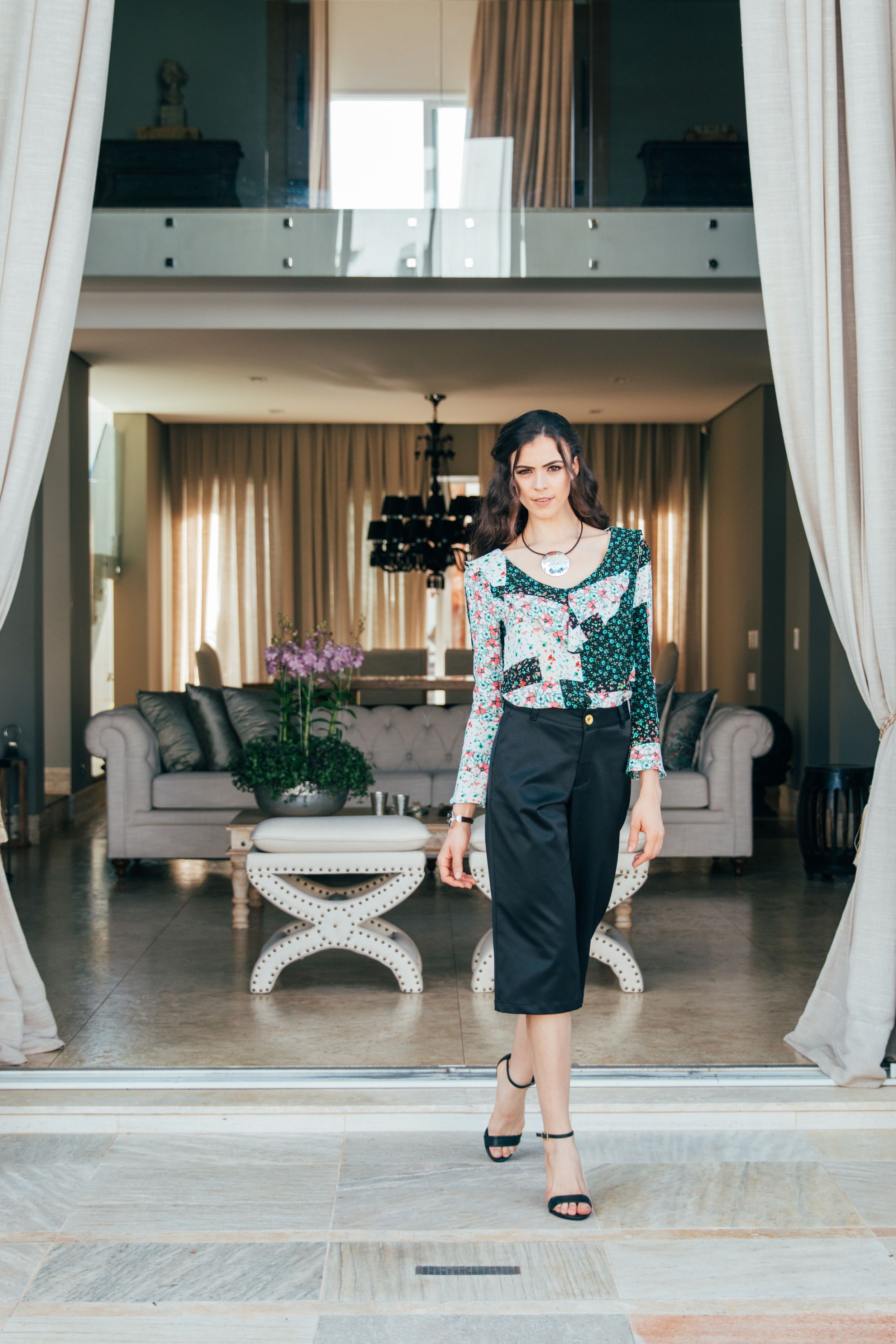 A series of elegant interior shots showing curtains and modern furniture in a minimalist open space venue.