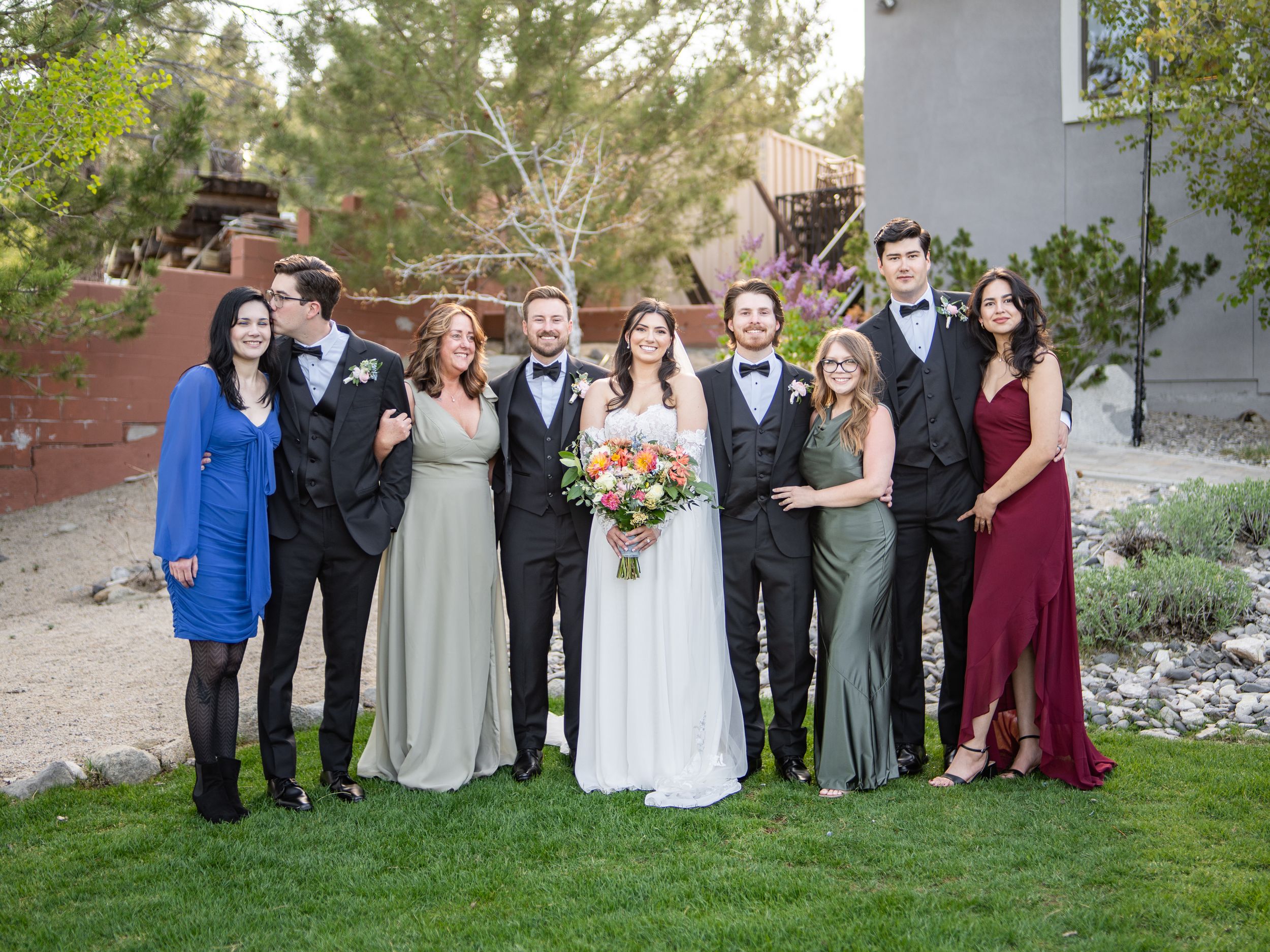 A series of formal group portraits featuring bridesmaids and groomsmen posed together outdoors at a wedding celebration.