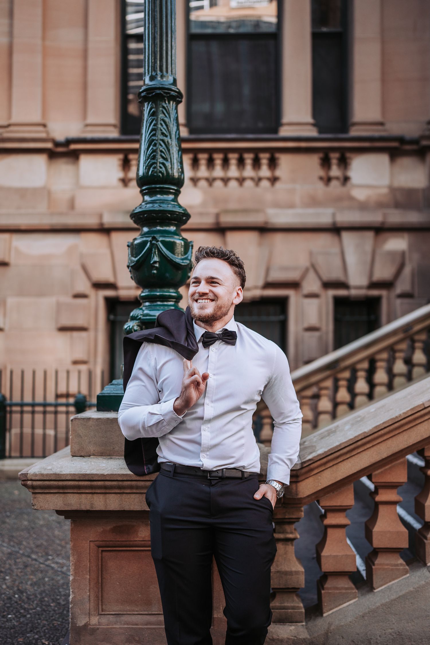 Three connected lifestyle portraits on brownstone steps with brick wall backdrop and decorative ornate lamp post.