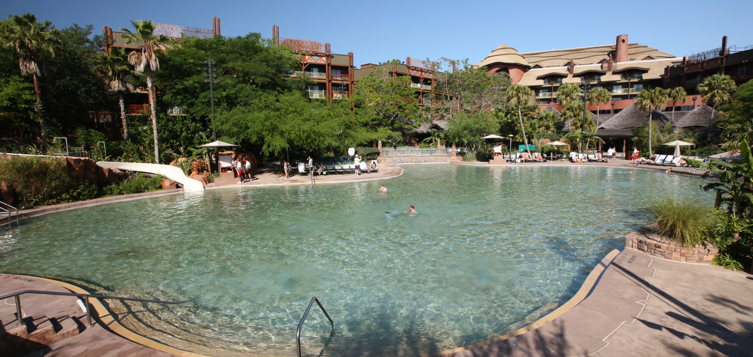 Panoramic view of Animal Kingdom Lodge resort buildings and swimming pool area.