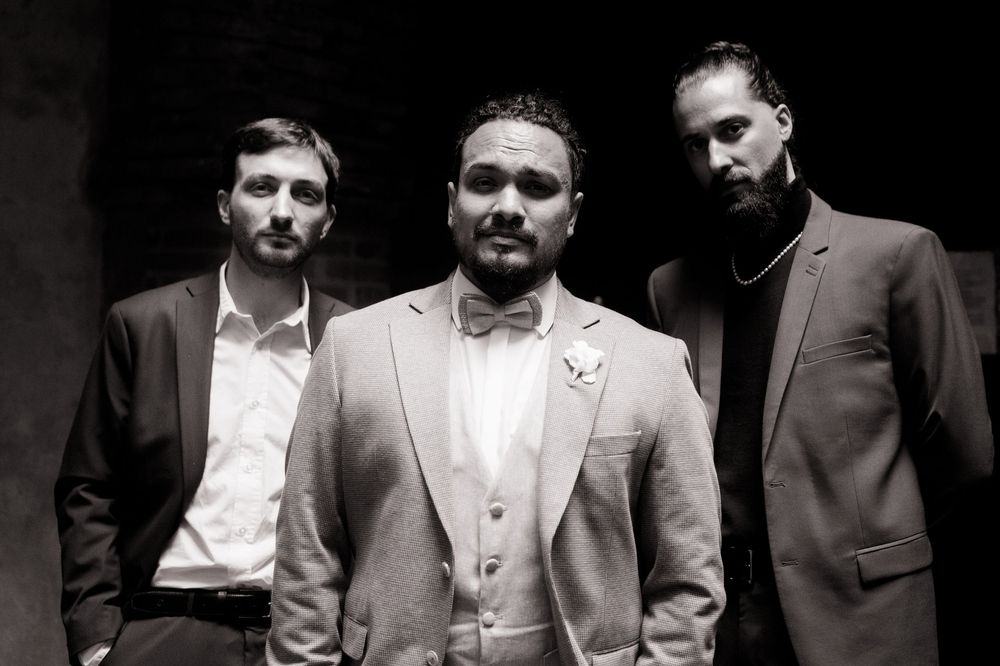 Professional portrait shots showing people in formal attire against dark backgrounds.