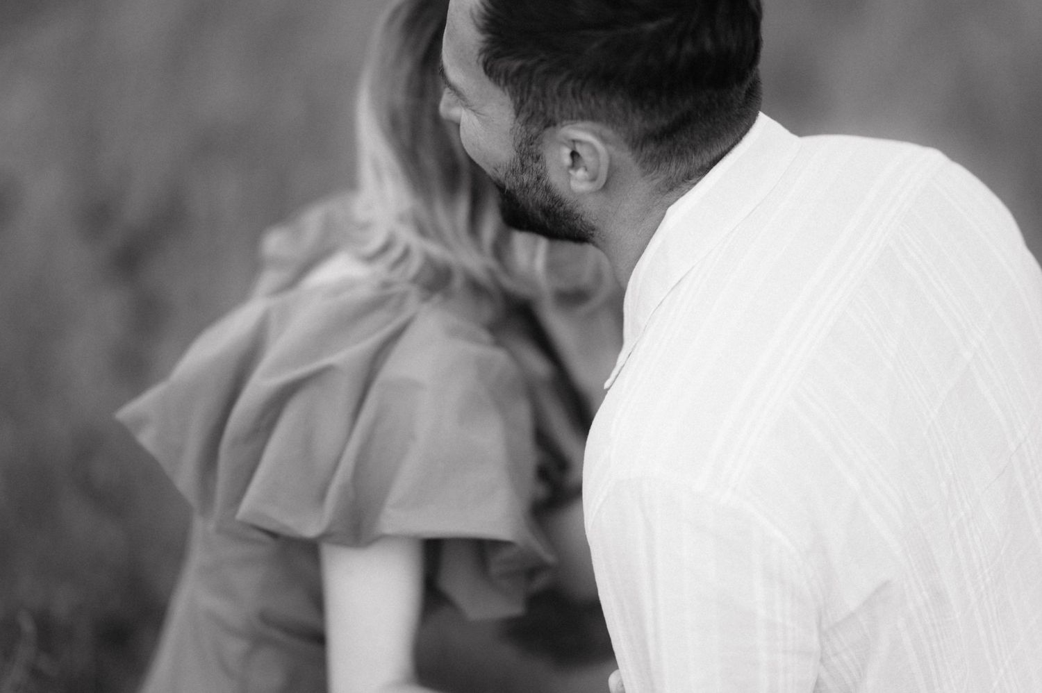 A series of vintage black and white photographs showing intimate moments between people in casual settings.