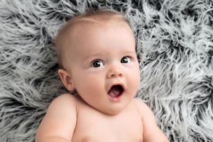 Happy baby portrait by professional Menifee photographer.
