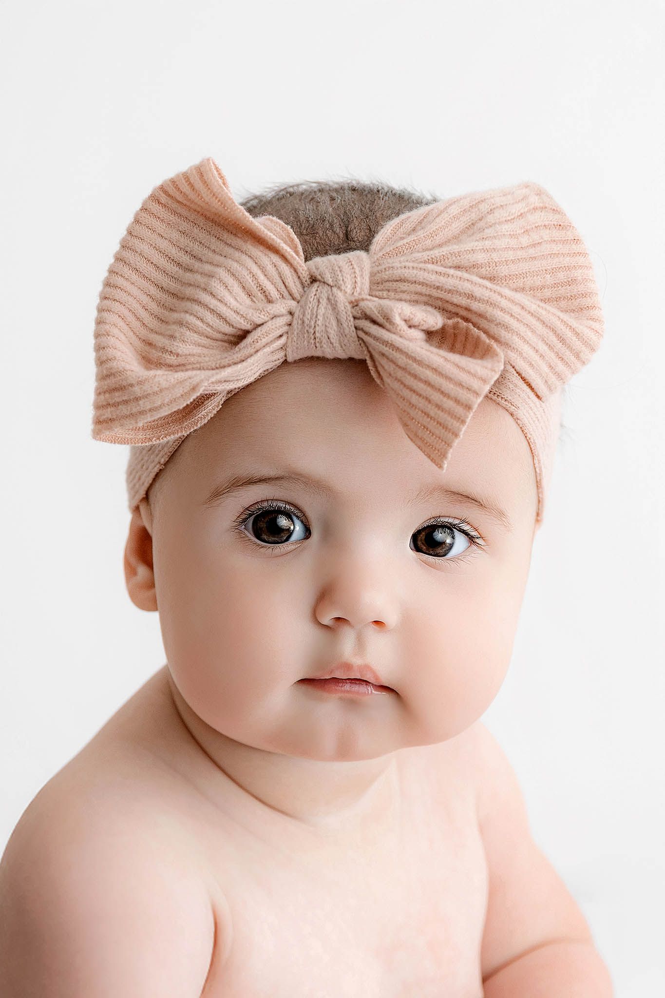 8 month old sitter session in Temecula; Portrait of cute baby girl with big brown eyes.