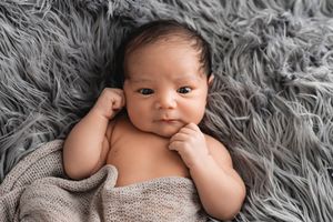 Portrait of alert newborn baby boy.