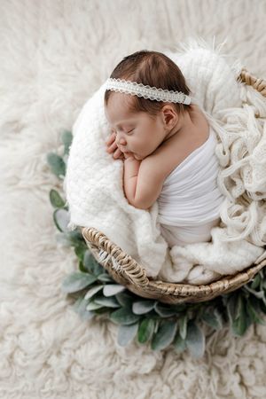 Professional newborn photographer in Menifee: cute baby girl sleeping by Emily Menzie Photography.