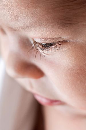 Close-up portrait of baby's lashes by professional Menifee newborn photographer.