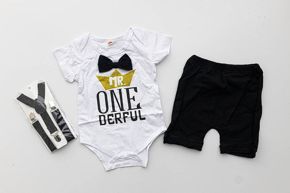 White Mr. ONEderful baby bodysuit with bow tie for Menifee California professional birthday photos.