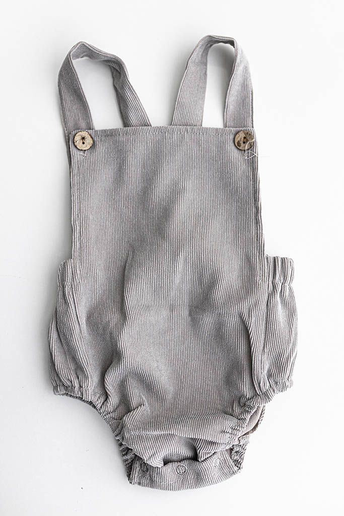 Gray corduroy baby romper for baby photography session in Lake Elsinore.