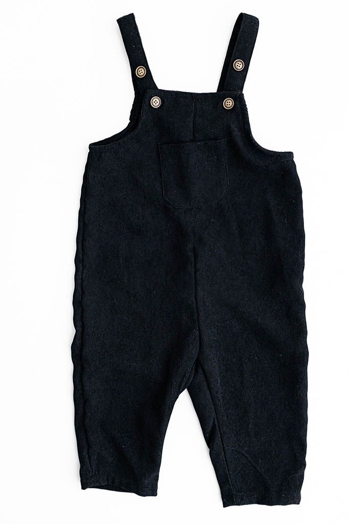 Black corduroy baby overalls from baby photographer studio in Temecula.