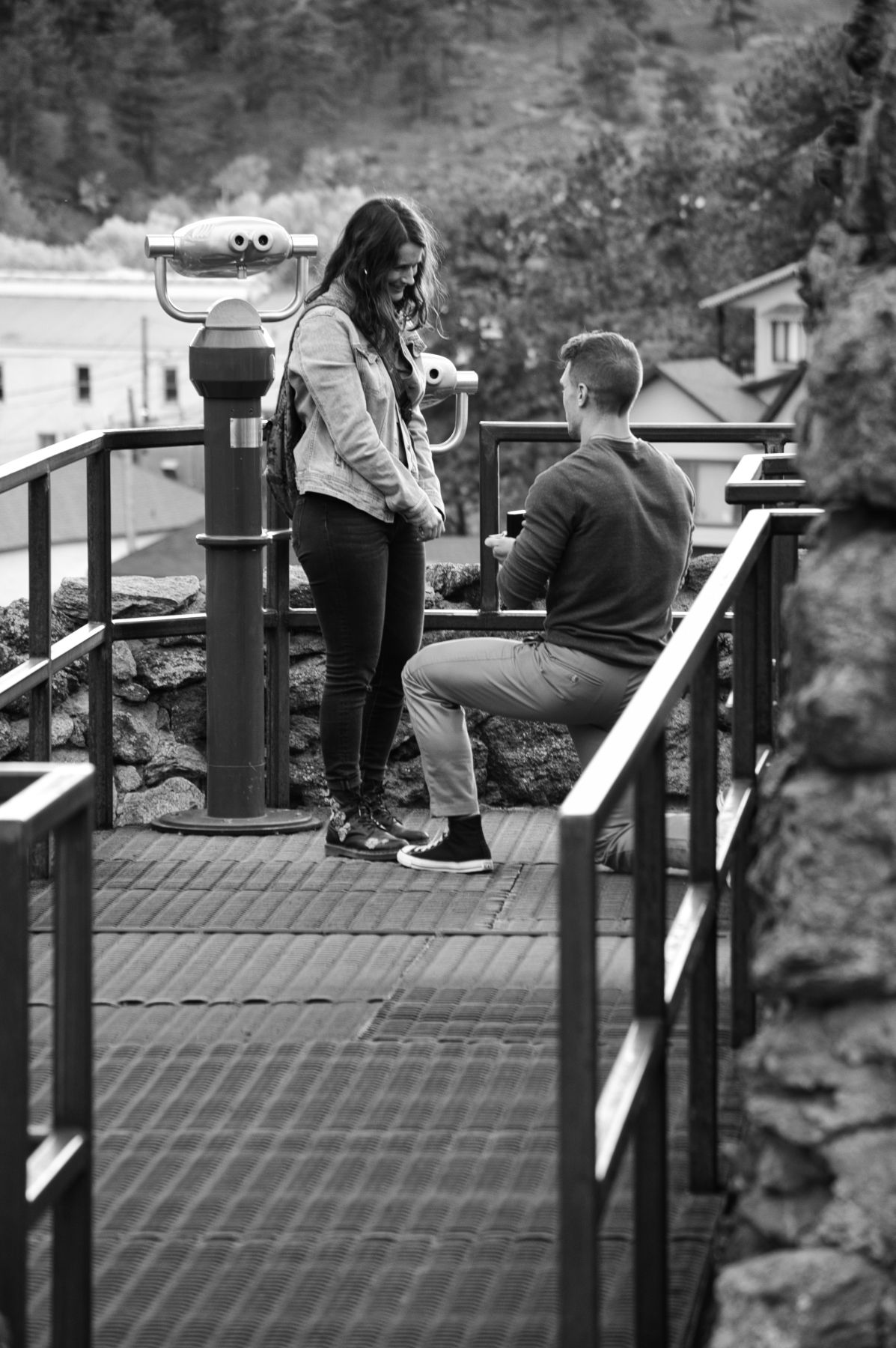 Man and woman couple, he is proposing to her in Estes Park, Colorado. Photographer: Pixcapades