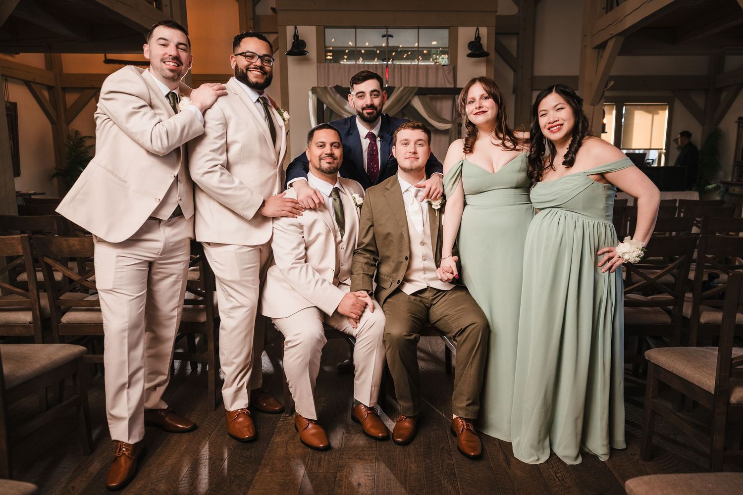Full wedding party group portrait at Briar Barn Inn ceremony space with bride, groom, groomsmen, and bridesmaids