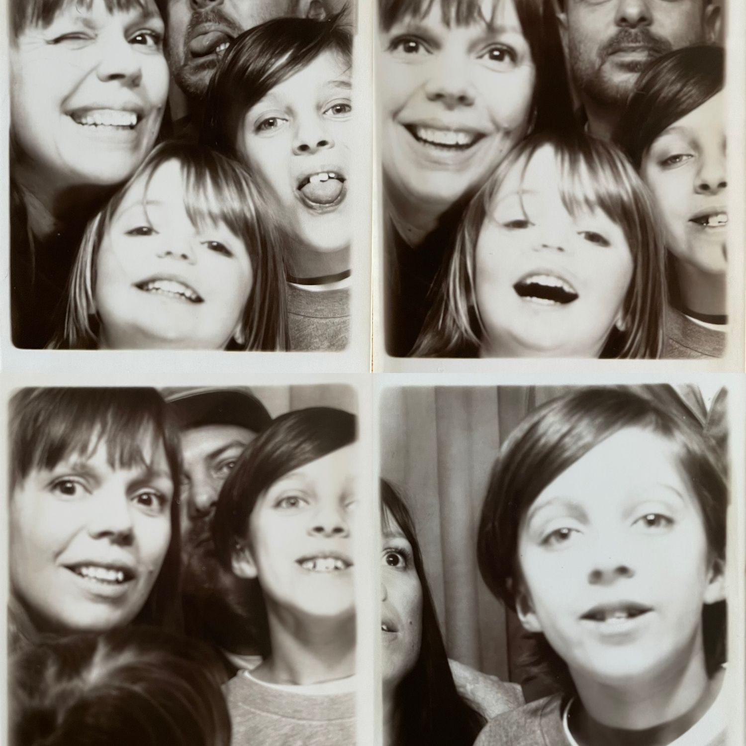 Black and white photo booth strip showing four playful poses with people smiling and making silly expressions.