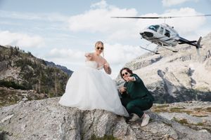 This was a fairytale elopement in Revelstoke, BC with Glacier Helicopters. The mountain top, skyline, and pastel wildflowers were a dream!