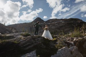 This was a fairytale elopement in Revelstoke, BC with Glacier Helicopters. The mountain top, skyline, and pastel wildflowers were a dream!