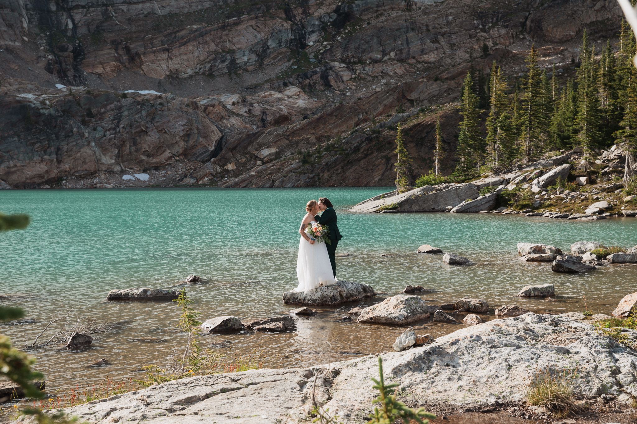 This was a fairytale elopement in Revelstoke, BC with Glacier Helicopters. The mountain top, skyline, and pastel wildflowers were a dream!