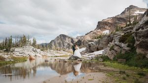 This was a fairytale elopement in Revelstoke, BC with Glacier Helicopters. The mountain top, skyline, and pastel wildflowers were a dream!