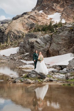 This was a fairytale elopement in Revelstoke, BC with Glacier Helicopters. The mountain top, skyline, and pastel wildflowers were a dream!