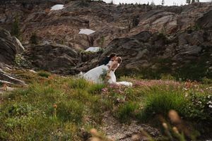 This was a fairytale elopement in Revelstoke, BC with Glacier Helicopters. The mountain top, skyline, and pastel wildflowers were a dream!