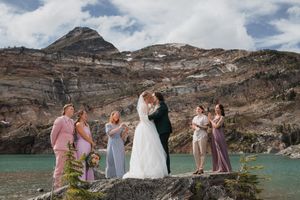 This was a fairytale elopement in Revelstoke, BC with Glacier Helicopters. The mountain top, skyline, and pastel wildflowers were a dream!