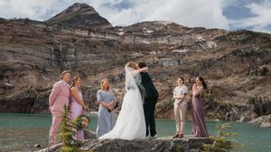 This was a fairytale elopement in Revelstoke, BC with Glacier Helicopters. The mountain top, skyline, and pastel wildflowers were a dream!