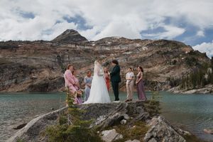 This was a fairytale elopement in Revelstoke, BC with Glacier Helicopters. The mountain top, skyline, and pastel wildflowers were a dream!