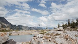 This was a fairytale elopement in Revelstoke, BC with Glacier Helicopters. The mountain top, skyline, and pastel wildflowers were a dream!