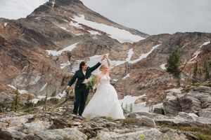 This was a fairytale elopement in Revelstoke, BC with Glacier Helicopters. The mountain top, skyline, and pastel wildflowers were a dream!