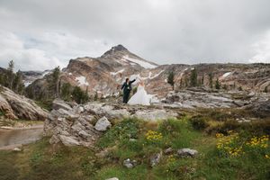This was a fairytale elopement in Revelstoke, BC with Glacier Helicopters. The mountain top, skyline, and pastel wildflowers were a dream!