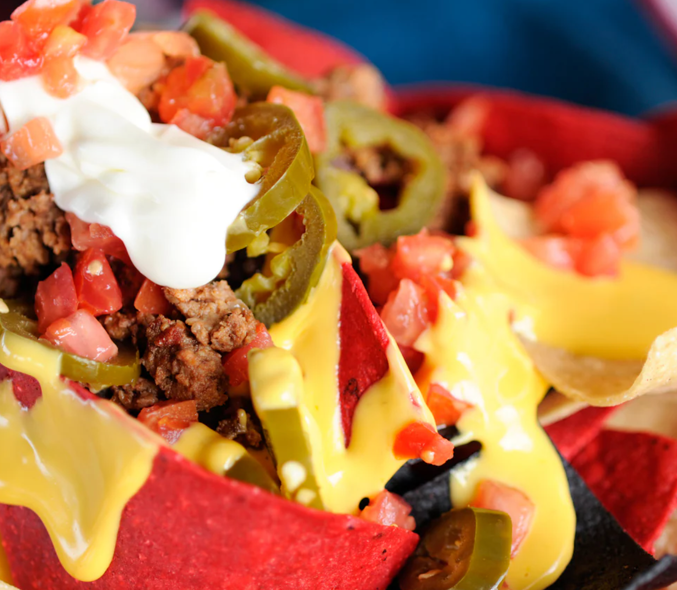 Loaded nachos topped with seasoned beef, sour cream, jalapeños and fresh tomatoes.