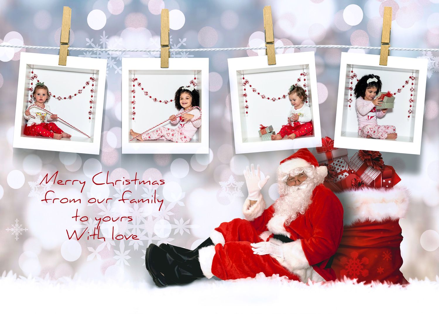 Christmas photos hanging on clothespins with bokeh lights and holiday decorations.