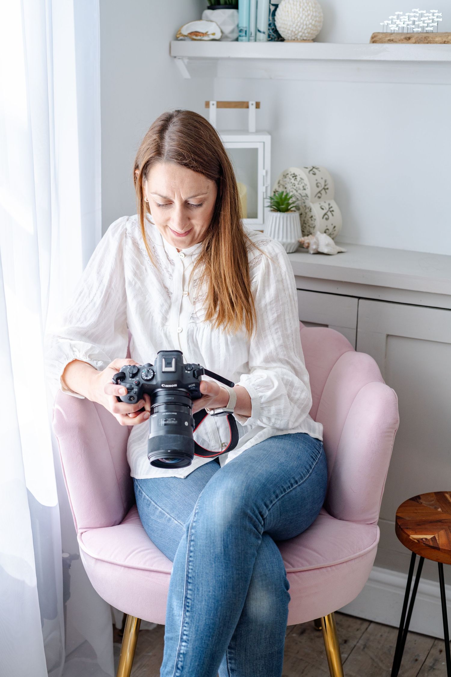 Women on London street for headshot branding looking at each other with natural sunlight