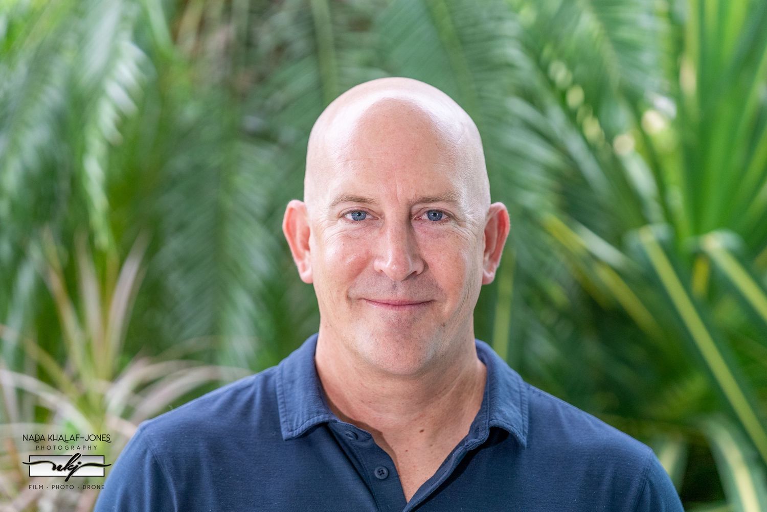 Professional portrait series against lush tropical greenery background.