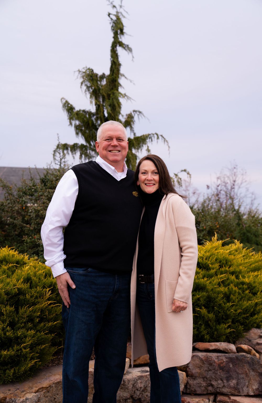Couple photographed outdoors by Roam Media LLC.