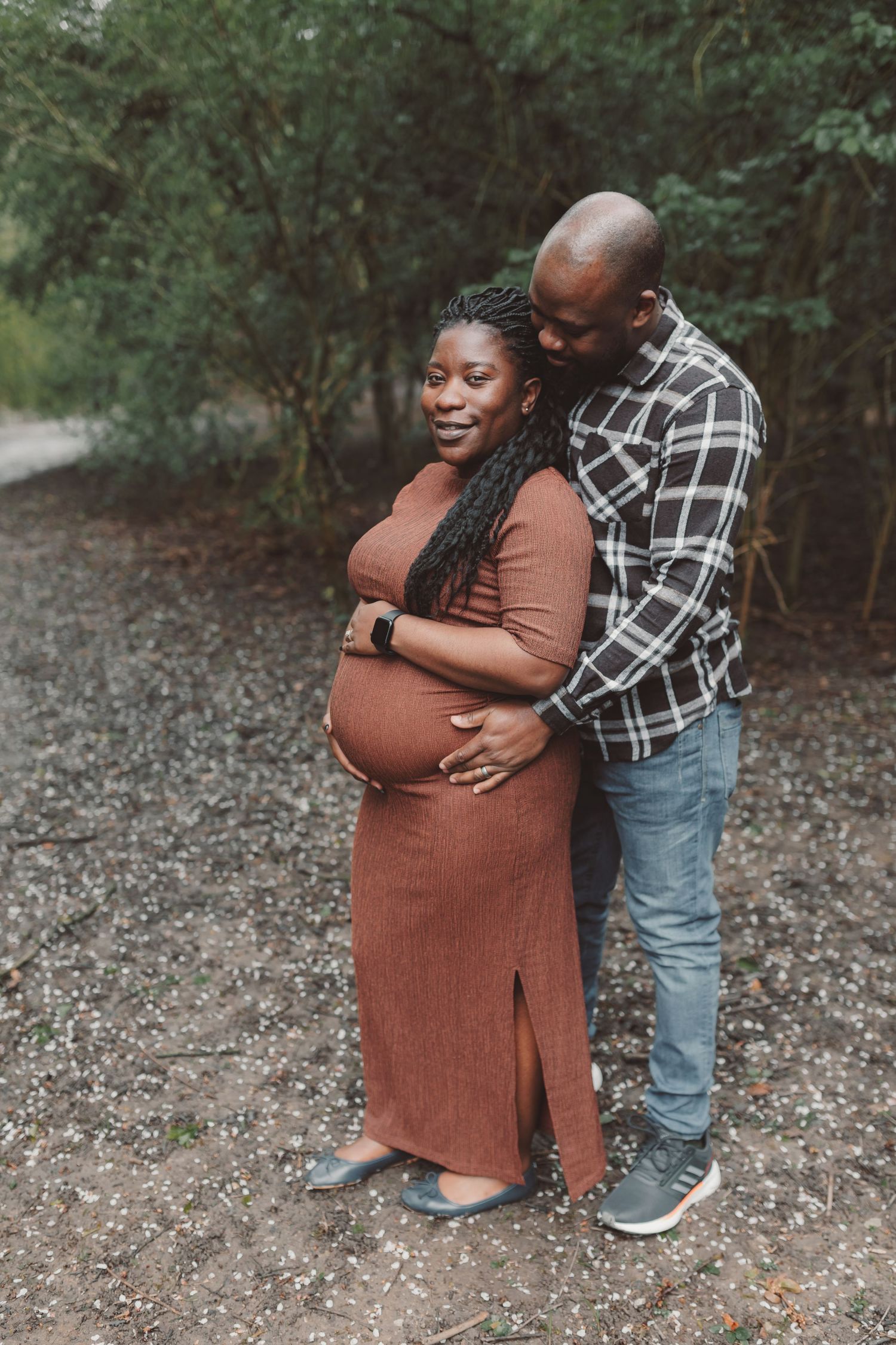 Loving couple embracing during outdoor maternity photoshoot in natural setting. Photographer. Hull. East Yorkshire. Photography